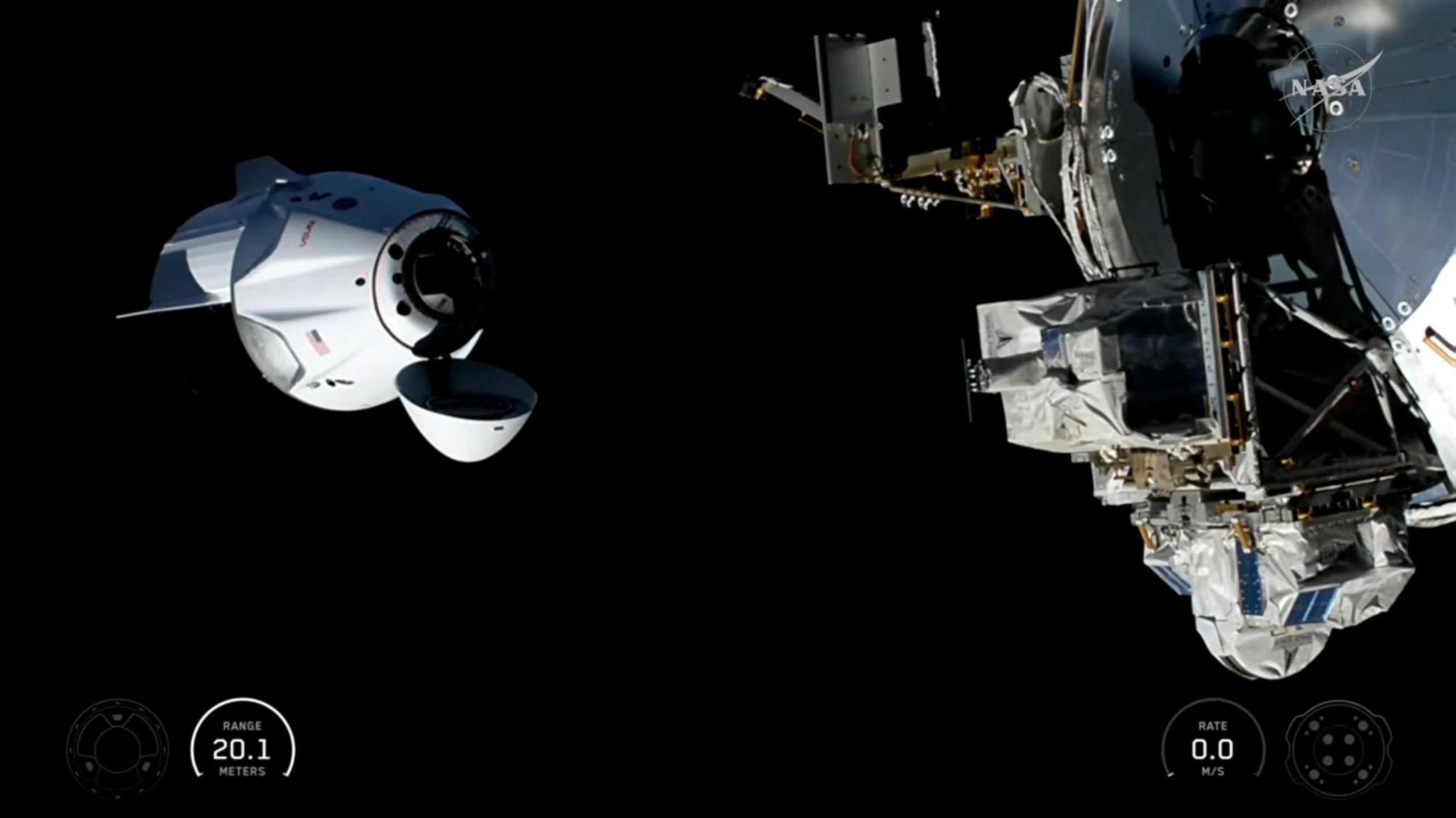 a white space capsule approaches the international space station