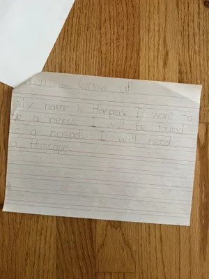 Harper Anderson, 6, writes about what she wants to do when she grows up.