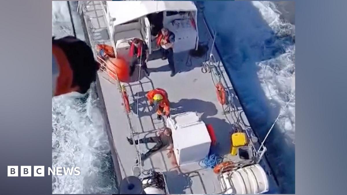 A rescue operation following a fire on a vessel outside Romania's territorial waters, in which two people died and others were rescued, in this screengrab obtained from a handout video released on October 5, 2026.