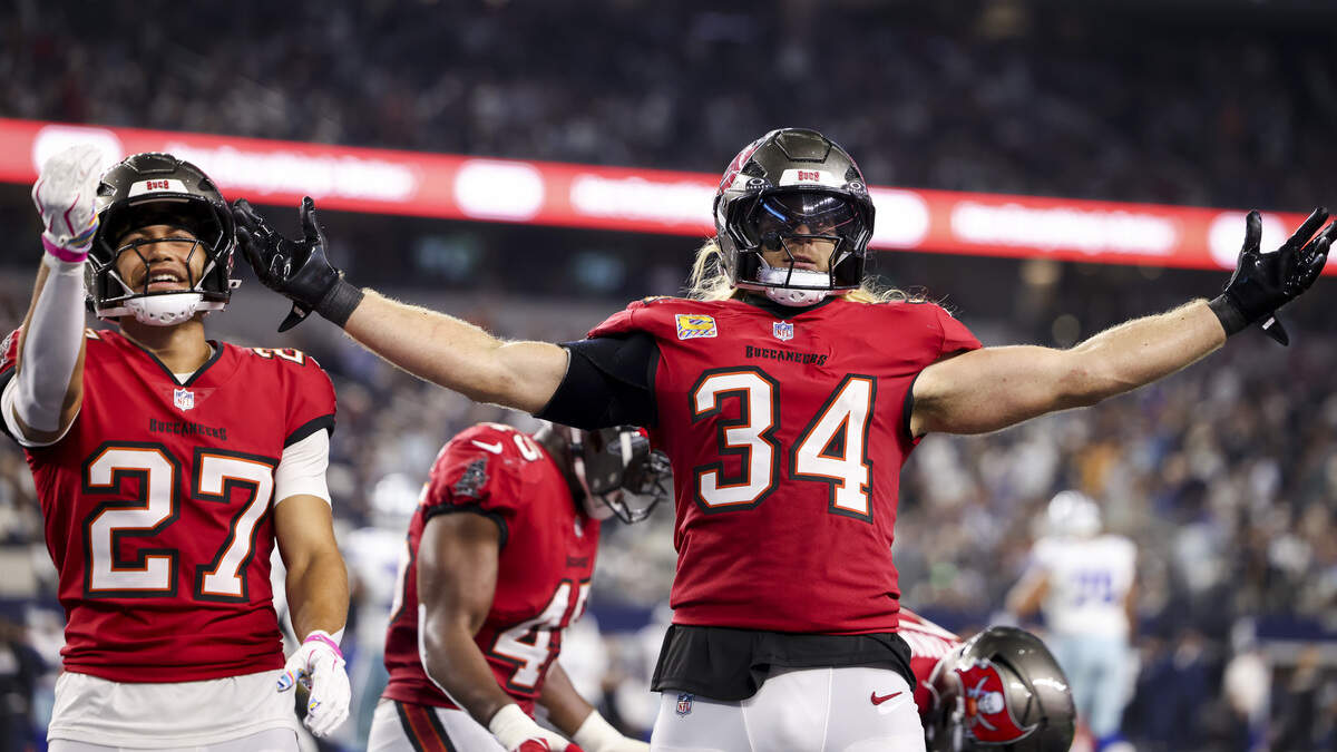 Tampa Bay Buccaneers middle linebacker Alex Anzalone (34) celebrates intercepting the ball during the second half of the game on Thursday, Oct. 8, 2026, at AT&T Stadium in Arlington.