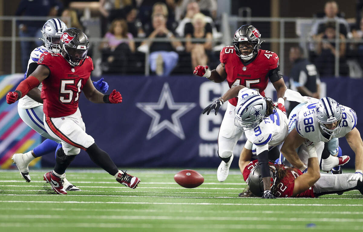 A Dallas Cowboys ball comes loose and is recovered by the Tampa Bay Buccaneers during the second half of the game on Thursday, Oct. 8, 2026, at AT&T Stadium in Arlington.