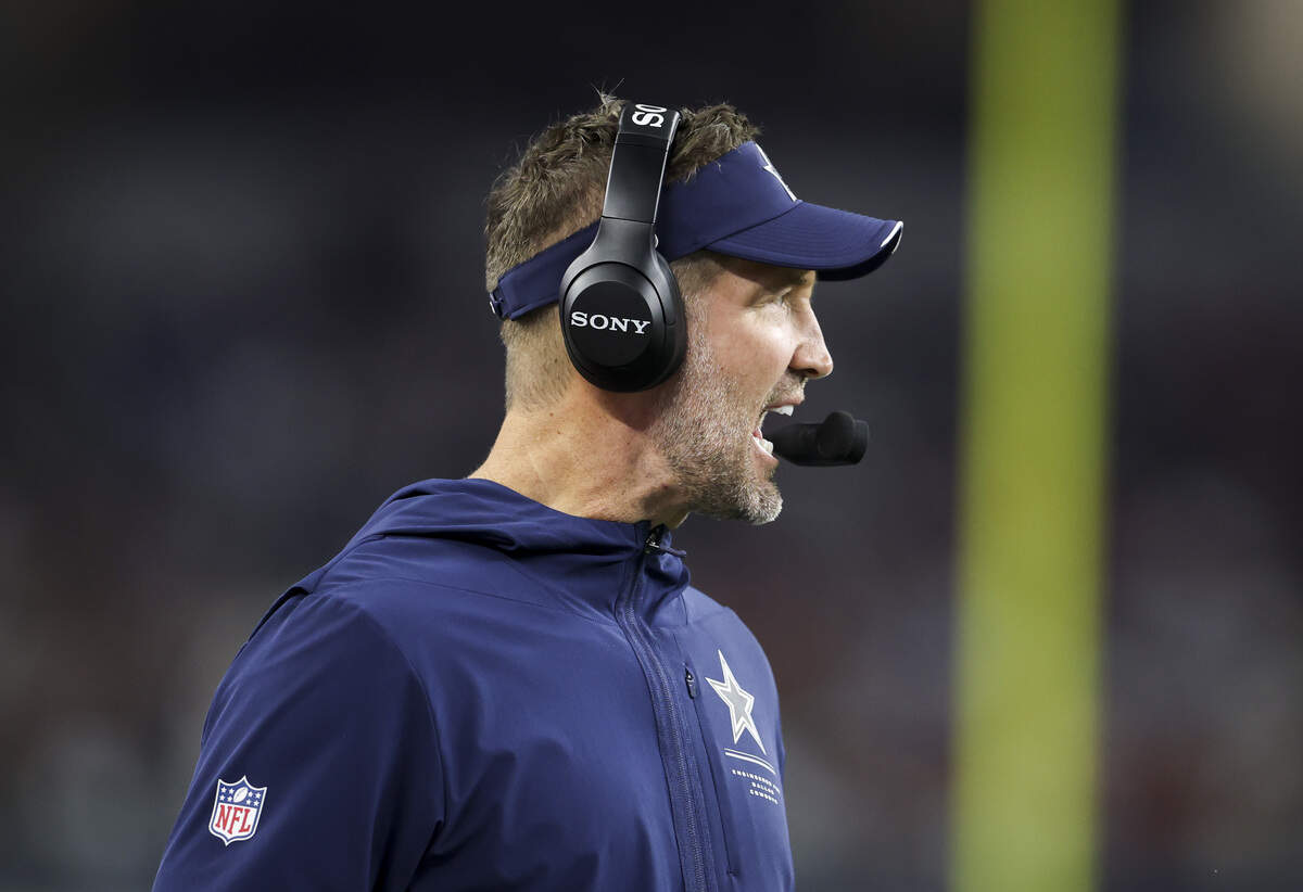 Dallas Cowboys head coach Brian Schottenheimer calls out during a play from the sidelines during the first half of the game on Thursday, Oct. 8, 2026, at AT&T Stadium in Arlington.