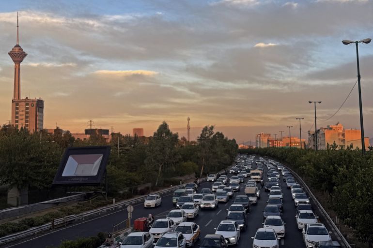 Vehicles drive along a busy road during the evening peak hour in Tehran on October 4, 2026. [Atta Kenare/AFP]