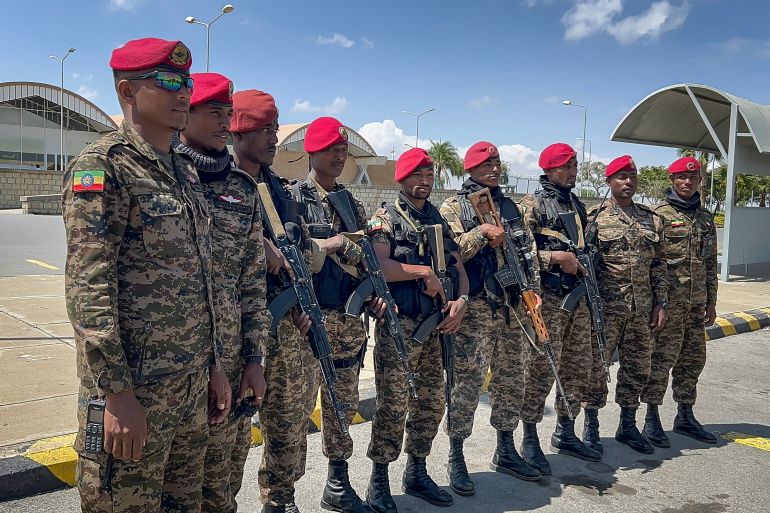 Members of the Ethiopian National Defense Force (ENDF) gather in front of Mekelle Alula Aba Nega International Airport after federal forces retook control of the facility in Mekelle, Ethiopia, October 6, 2026 [AFP]
