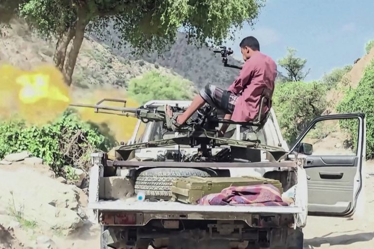 AFPTV video footage shows a member of the Yemeni government forces firing a machinegun, October 8