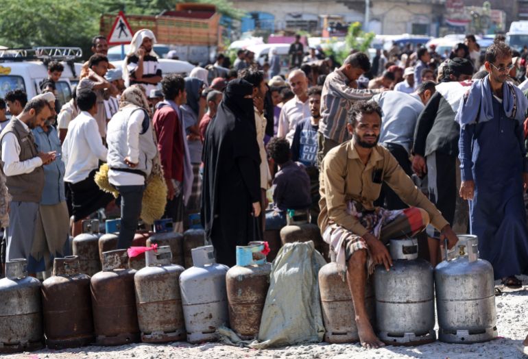 Yemenis wait at a refilling station in Taiz as fighting intensifies the Houthis seized the country's Red Sea coast last month, October 19, 2026 [Ahmad al-Basha/AFP]