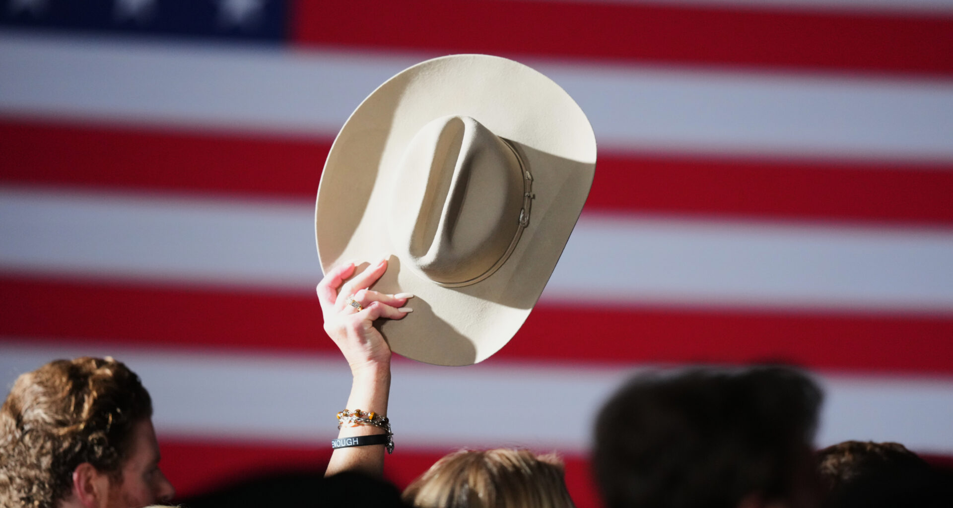A supporter raises their hat at an election night primary watch party for Texas Attorney General Ken Paxton, a Republican candidate for the U.S. Senate, on Tuesday, March 3, 2026, in Dallas.