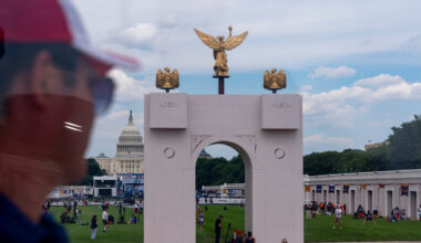 The U.S. Capitol and a mock-up of President Donald Trump's proposed triumphal arch are seen from the ferris wheel at the Great American State Fair on the National Mall, Thursday, June 25, 2026, in Washington. (AP Photo/Jen Golbeck)