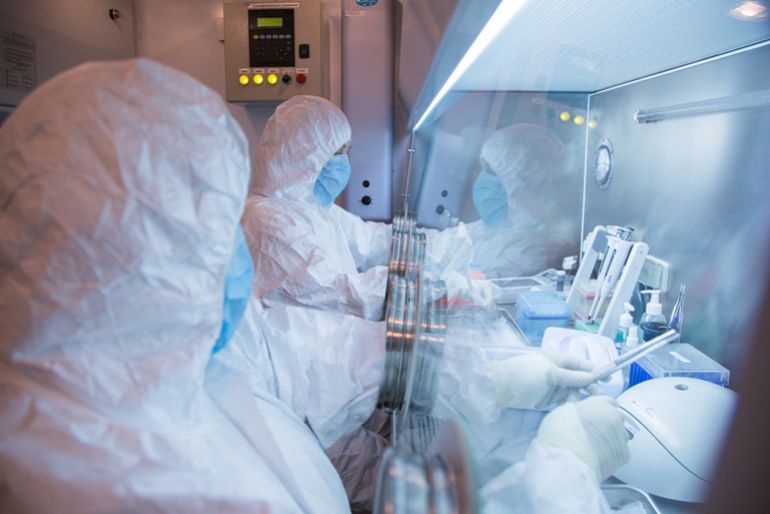 This undated photo released in 2019 by the Irkutsk Antiplague Research Institute of Siberia and the Far East shows institute workers in a lab [The Irkutsk Antiplague Research Institute of Siberia and Far East via AP]