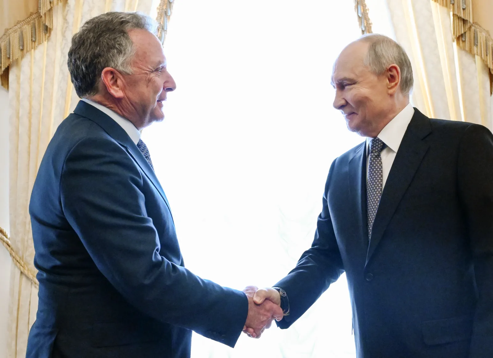 Russian President Vladimir Putin welcomes President Donald Trump's special envoy Steve Witkoff before a meeting at the Constantine Palace in Strelna, a suburb of St. Petersburg, Russia. Kristina Solovyova / Sputnik via AP