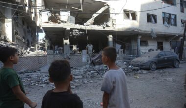 Children look at a damaged residential building in western Gaza City on Oct. 3, 2026. An overnight Israeli airstrike in western Gaza City killed Maisa Daoud and her daughter Mary, causing damage to nearby structures.