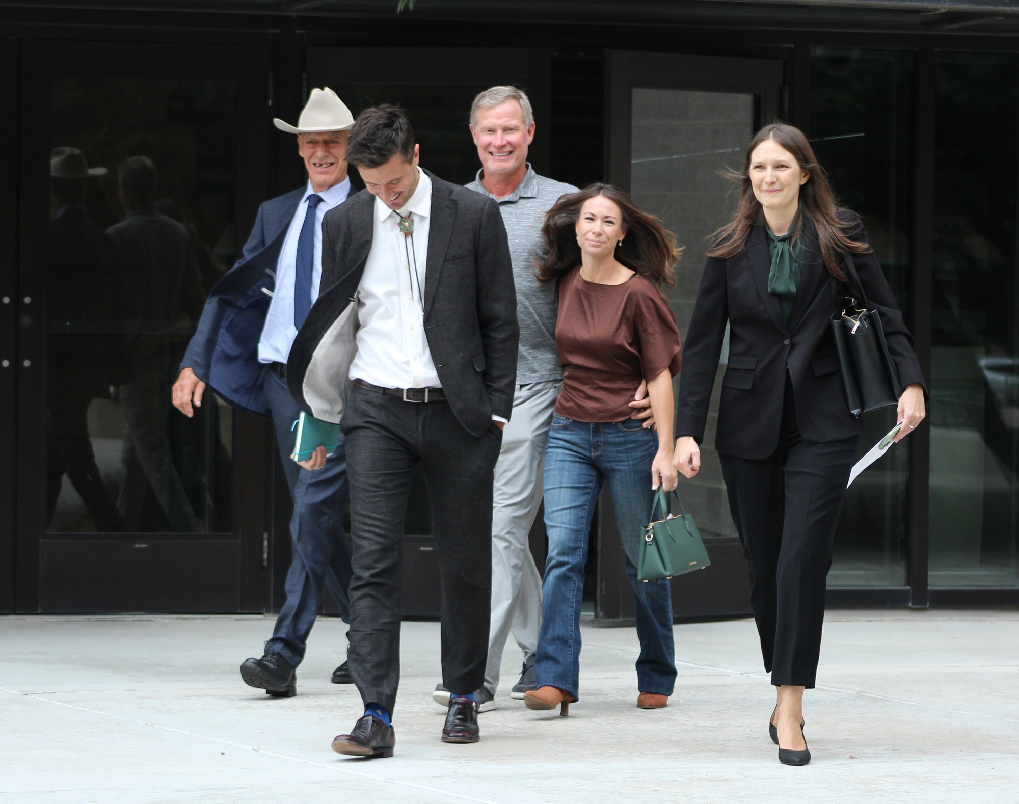 Zeynep Graves (right), an attorney for the Center for Biological Diversity, leaves court with witnesses Bill Guerra-Addington (far left) and Laiken Jordahl.