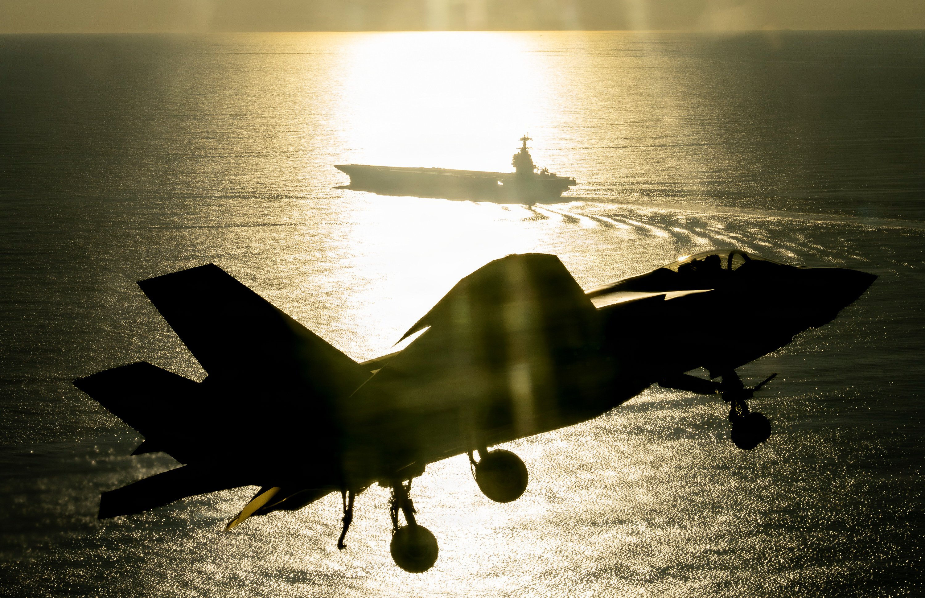 An F-35 test pilot from Air Test and Evaluation Squadron Two Three (VX-23), Naval Air Warfare Center Aircraft Division (NAWCAD), flies an F-35C Lightning II fighter aircraft to the PCU John F. Kennedy (CVN 79) in the Western Atlantic Oct. 13, 2026. This is the first time an F-35C has landed on a Ford-class aircraft carrier. A Patuxent River F-35 Integrated Test Force (ITF) team detached to the ship is conducting Aircraft Compatibility Testing (ACT) with the specially instrumented carrier variant of the stealth jet. ACT assesses the operational capabilities of the ship's aircraft launch and recovery equipment with U.S. Navy aircraft.
