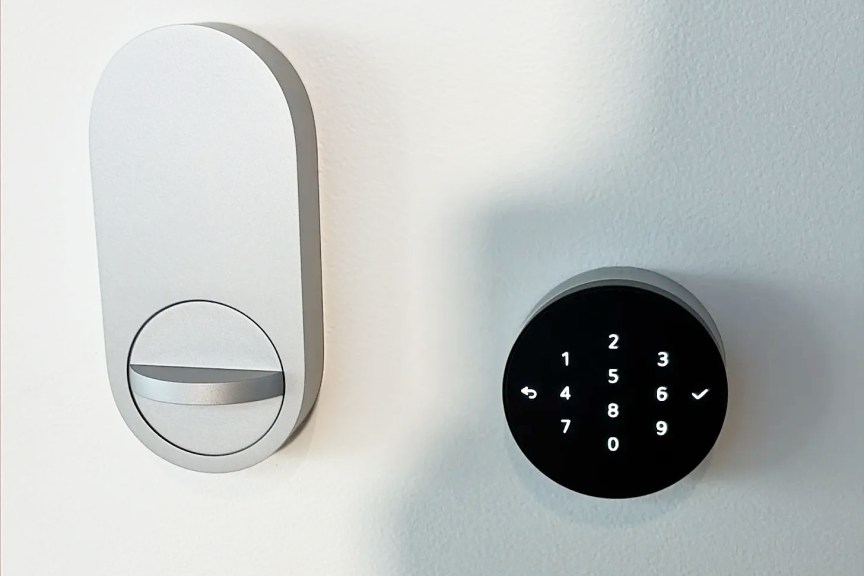 Apple smart lock displayed on wall.