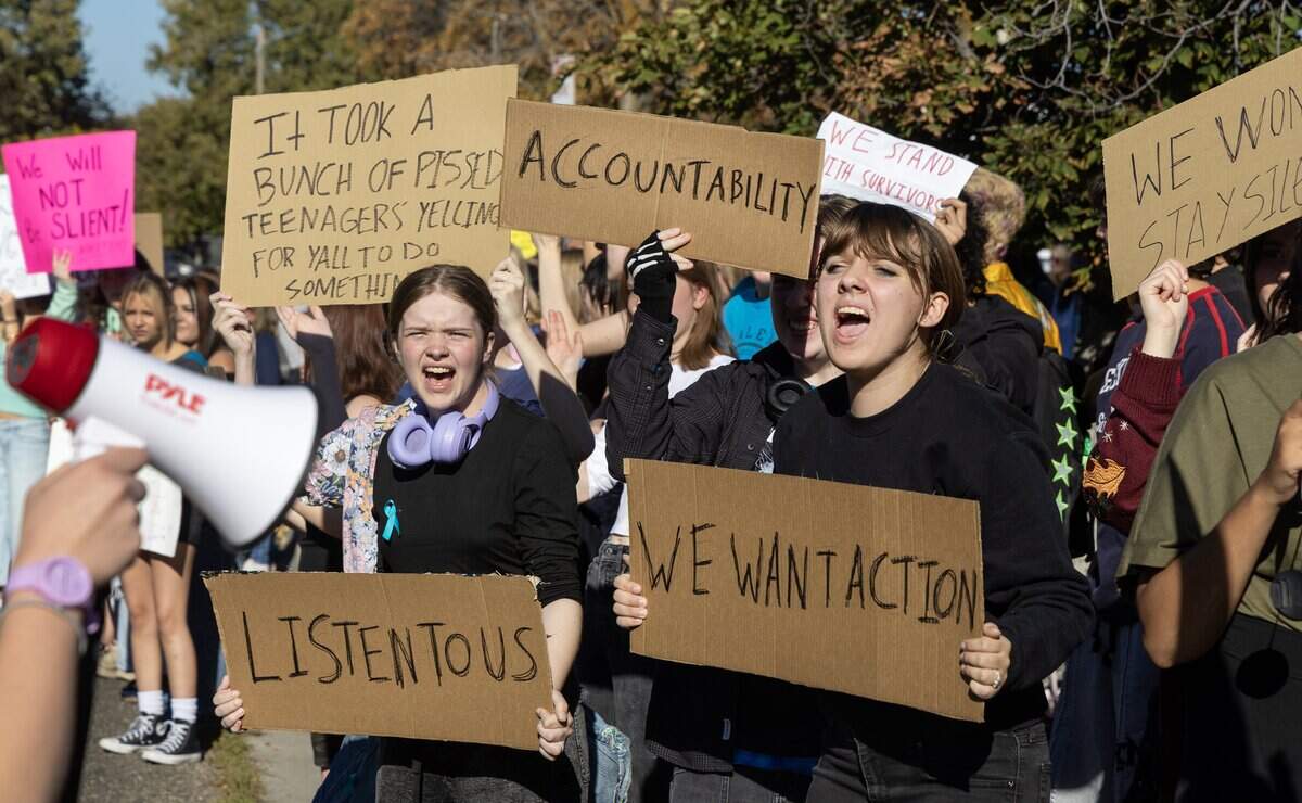 Students and community members participate in a walkout across the street from Timberline High School in Boise, Wednesday, October. 7, 2026. The student-led protest was in response to widely-shared screenshots of an alleged group chat between several members of the Timberline High School football team that referenced wanting to rape and kill a female student.