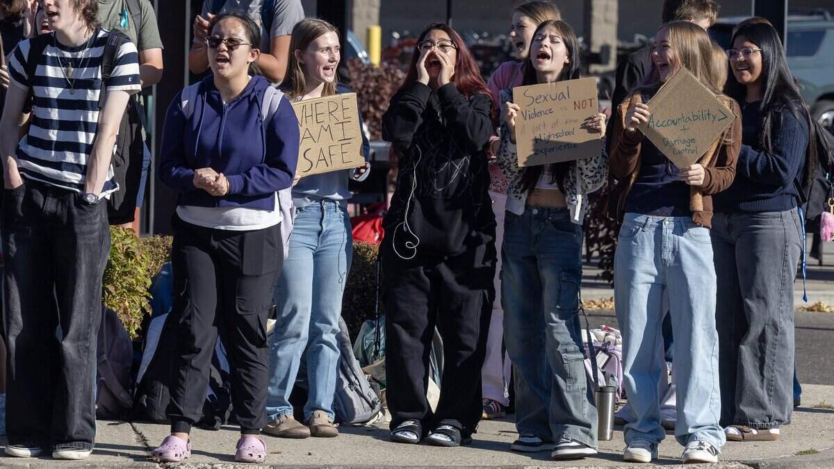 Students and community members participate in a walkout across the street from Timberline High School in Boise, Wednesday, October. 7, 2026. The student-led protest was in response to widely-shared screenshots of an alleged group chat between several members of the Timberline High School football team that referenced wanting to rape and kill a female student.