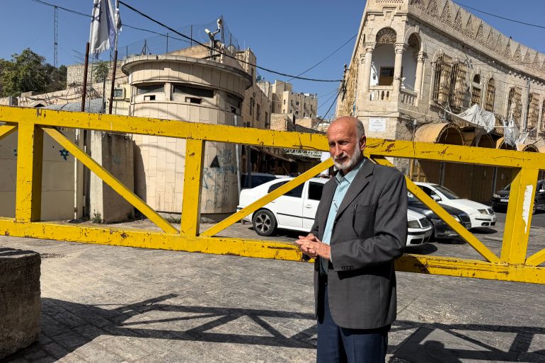 Badr Al-tamimi is forced to move between iron gates to reach other parts of the old city where he lived his whole life Photo by Sari Jaradat -1791707986