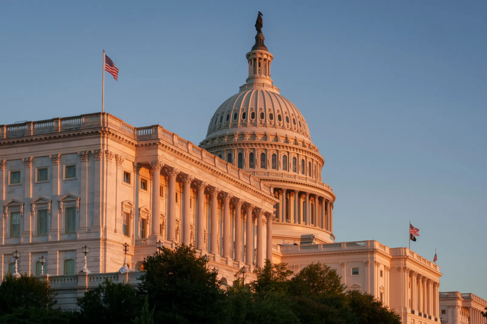 The setting sun casts a warm glow on the Senate side of the west front of the U.S. Capitol Building on September 14, 2026, in Washington, DC.