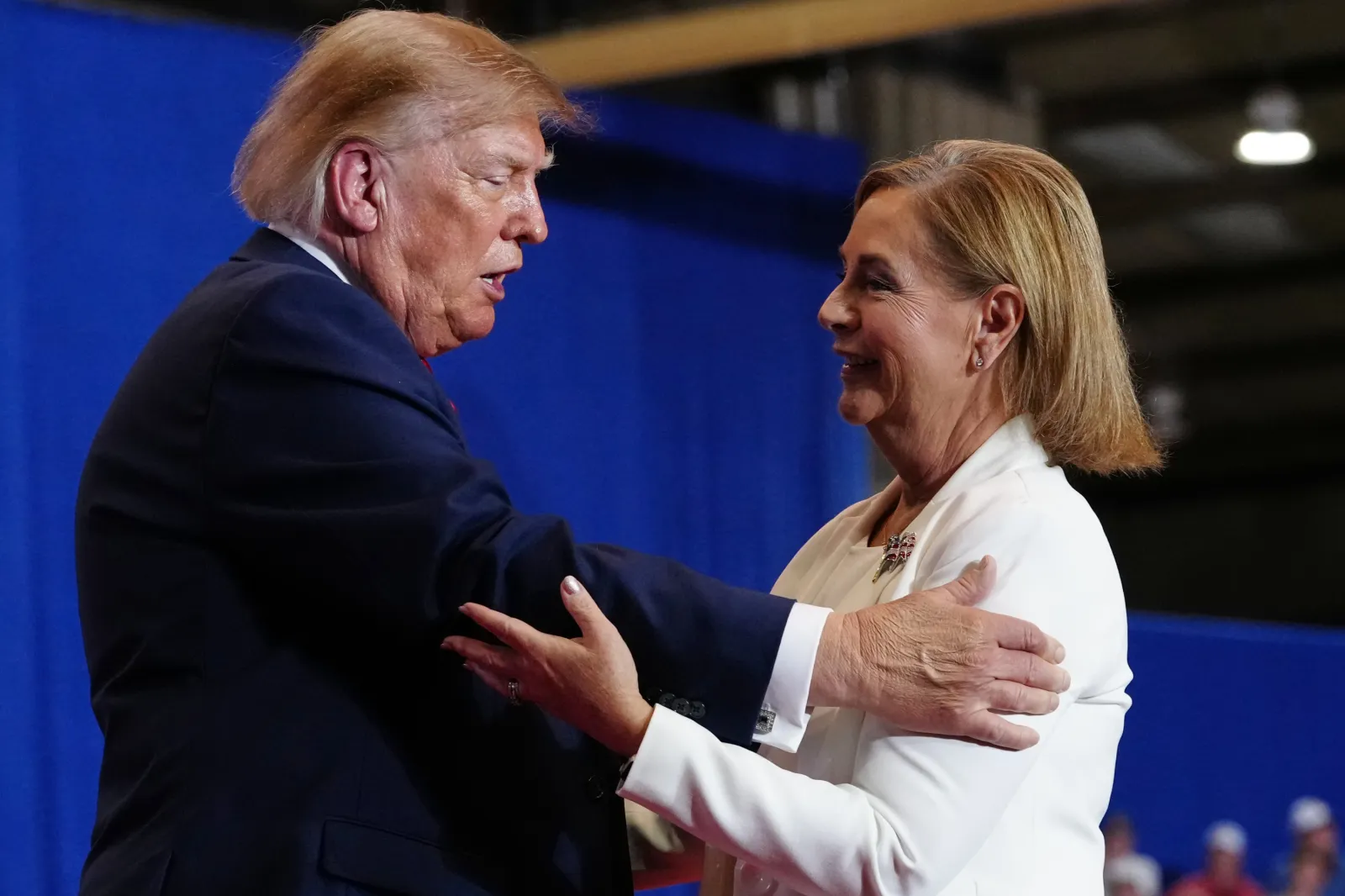 President Donald Trump greets Sen. Darline Graham, R-S.C., at a campaign rally at the T. Ed Garrison Arena, Wednesday, Oct. 21, 2026, in Pendleton, S.C.
