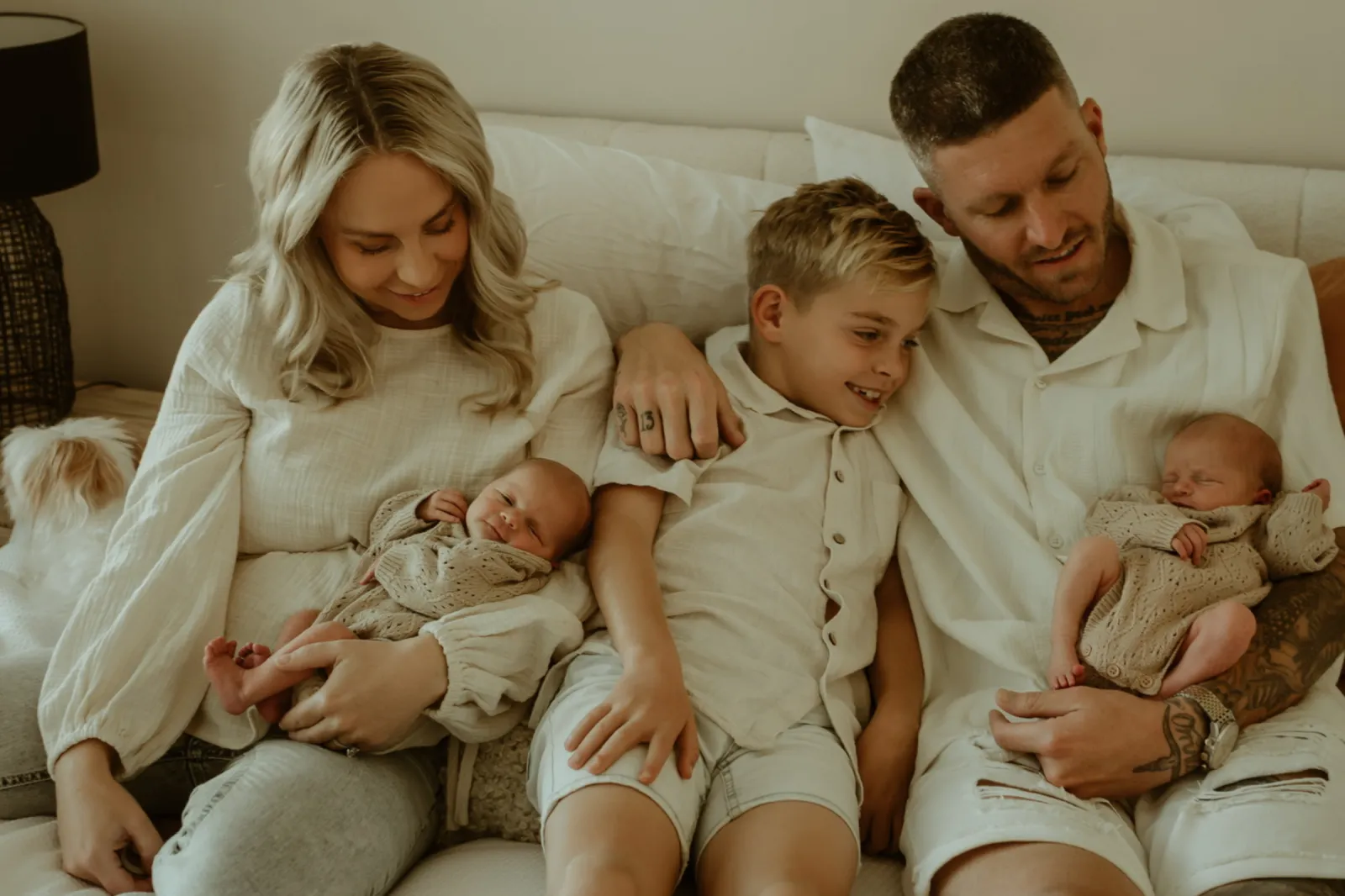 Rebecca with her twin daughters, son Braxton, and her husband.