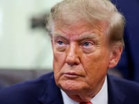 FILE PHOTO: US President Donald Trump looks on, as he makes a joint appearance with Vice President JD Vance (not pictured) in the Oval Office to announce a whistleblower program to encourage the public to report alleged fraud, at the White House in Washington, DC, US, October 20, 2026. REUTERS/Kevin Lamarque/File Photo
