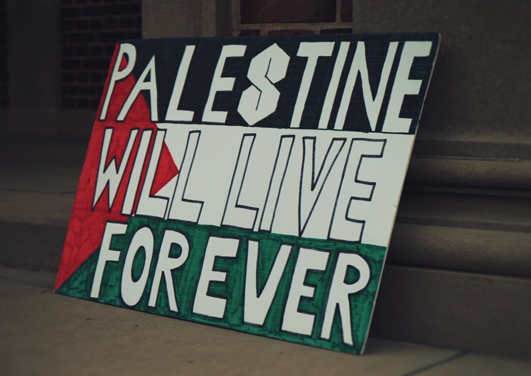 A sign reading “Palestine Will Live Forever” is displayed during “One Voice for Gaza” near the Morehead-Patterson Bell Tower on Wednesday, Oct. 7, 2026. Photo courtesy of Duaa Dafalla.