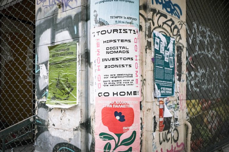 A ‘tourists go home’ poster in Exarchia, October 10 2026