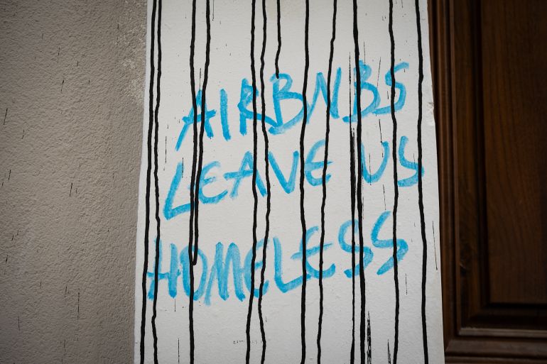One of the many slogans criticising short-term rentals in Exarchia, Athens, Greece