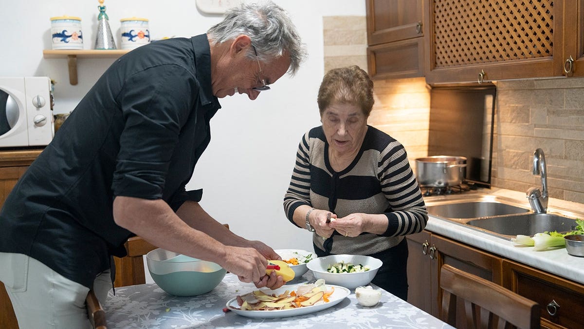 Dan Buettner preparing a traditional minestrone with Anna Maria Filia in Bolotana