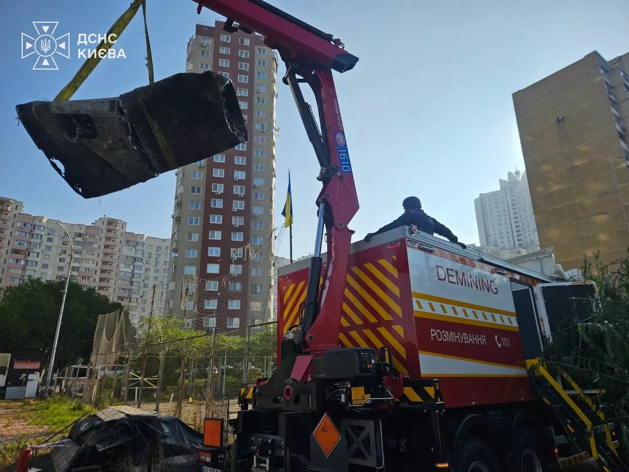 The remains of a Russian missile are removed after an attack on Kyiv.
