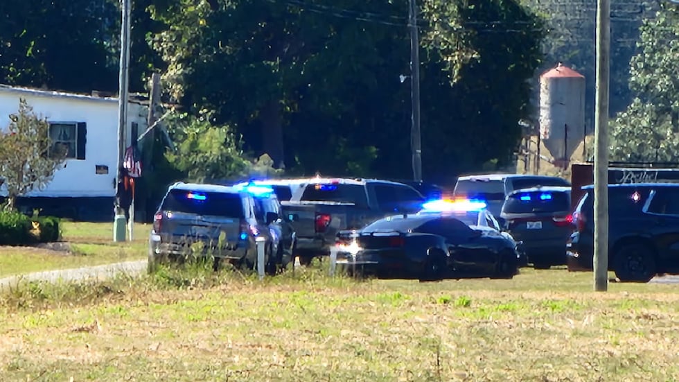 A large law enforcement presence is seen at a church on Jonestown Road.