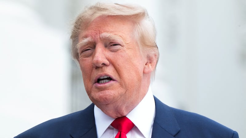 US President Donald Trump speaks with members of the press before walking to board Marine One at the White House in Washington, DC, US, October 10, 2026.