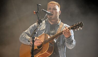 Zach Bryan performing onstage.