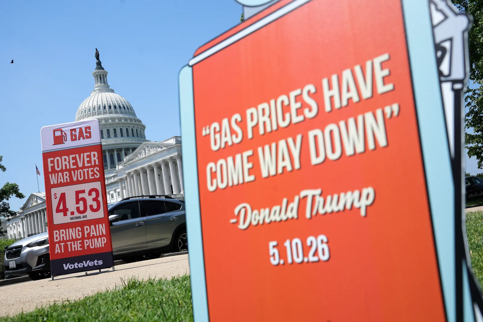 Signs protesting the Iran war and its impact on gas prices are seen during a protest organized by VoteVets outside of the U.S. Capitol on May 20, 2026 in Washington, DC.