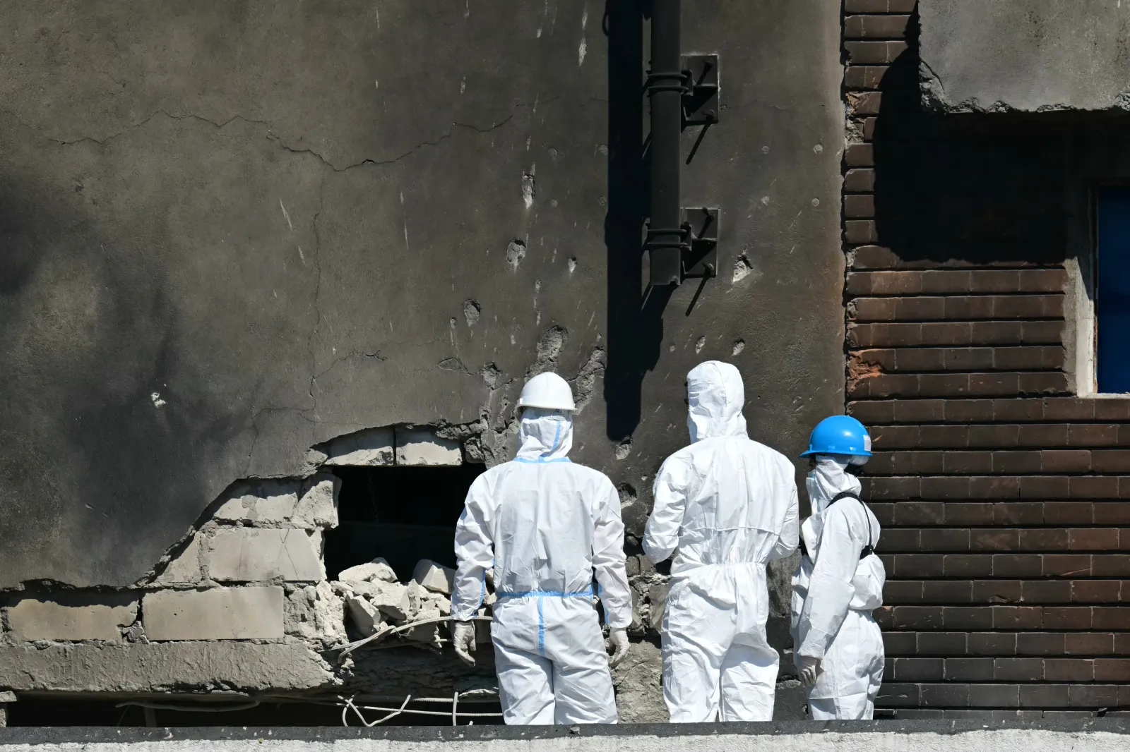 Investigators examine the aftermath of a Russian drone strike on an apartment building in Galati, Romania, on May 29, 2026.