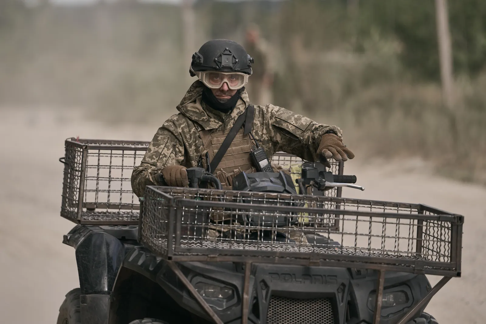 Ukrainian soldiers ride quad bikes along a road near the border with Russia on August 28, 2026, in Sumy Region, Ukraine.