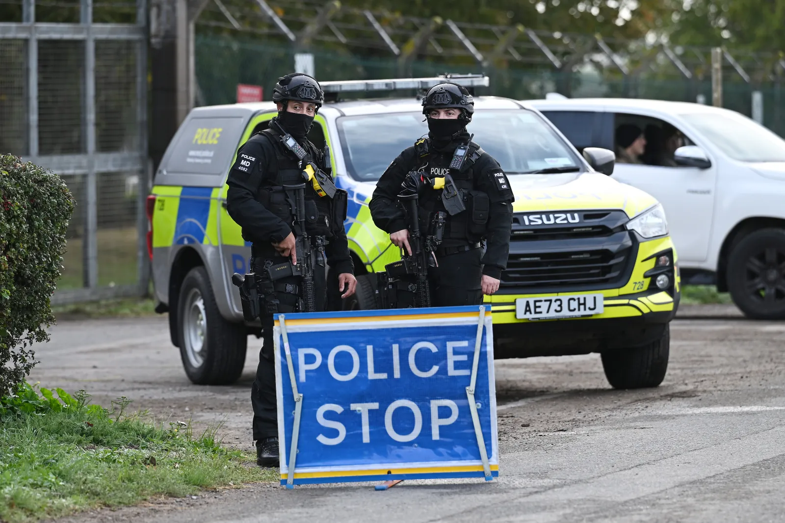 Armed police maintain a road block and security checks around RAF Fairford on September 28, 2026 in Fairford, England, following the arrest of five men on suspicion of committing offenses under the Explosives Act and preparation of a terrorist act.