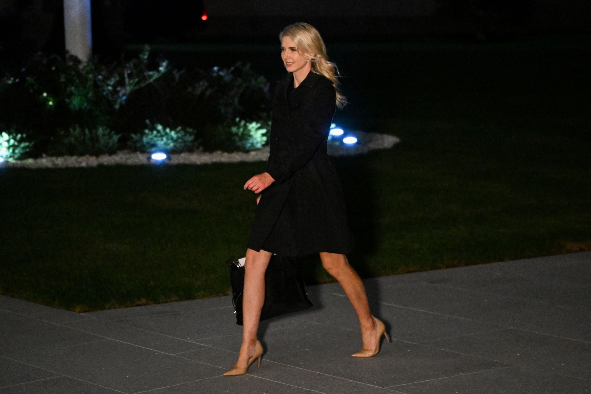 Question have been raised about Harp's proximity to President Donald Trump as she is often seen traveling with him