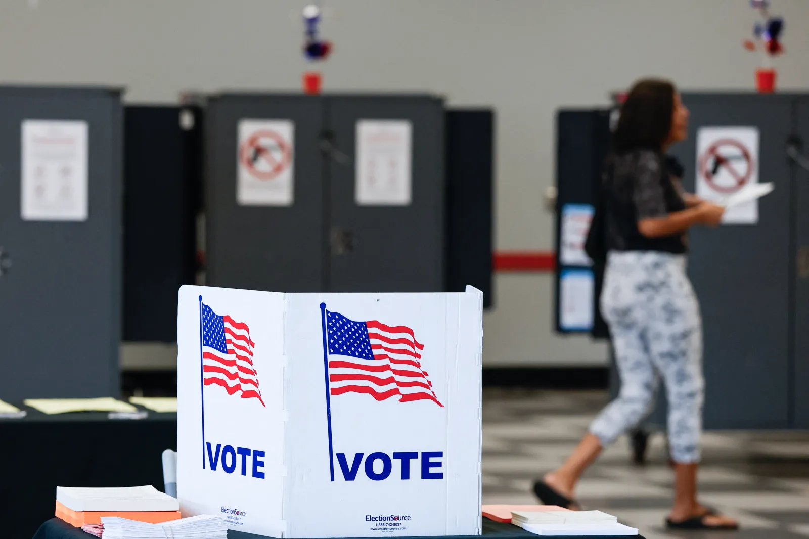 People vote at a polling location during early voting in the midterm election.