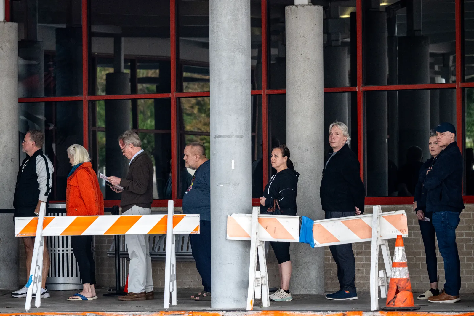 People wait in line at a polling location on the first day of early voting in Texas for the midterm elections, at the West Gray Metropolitan Multiservice Center in Houston, Texas, on October 19, 2026. Democrat James Talarico is facing Republican and Texas Attorney General Ken Paxton in a race for one of Texas's US Senate seats.