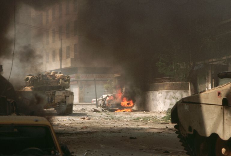 Israeli forces roll into west Beirut in mid-September 1982