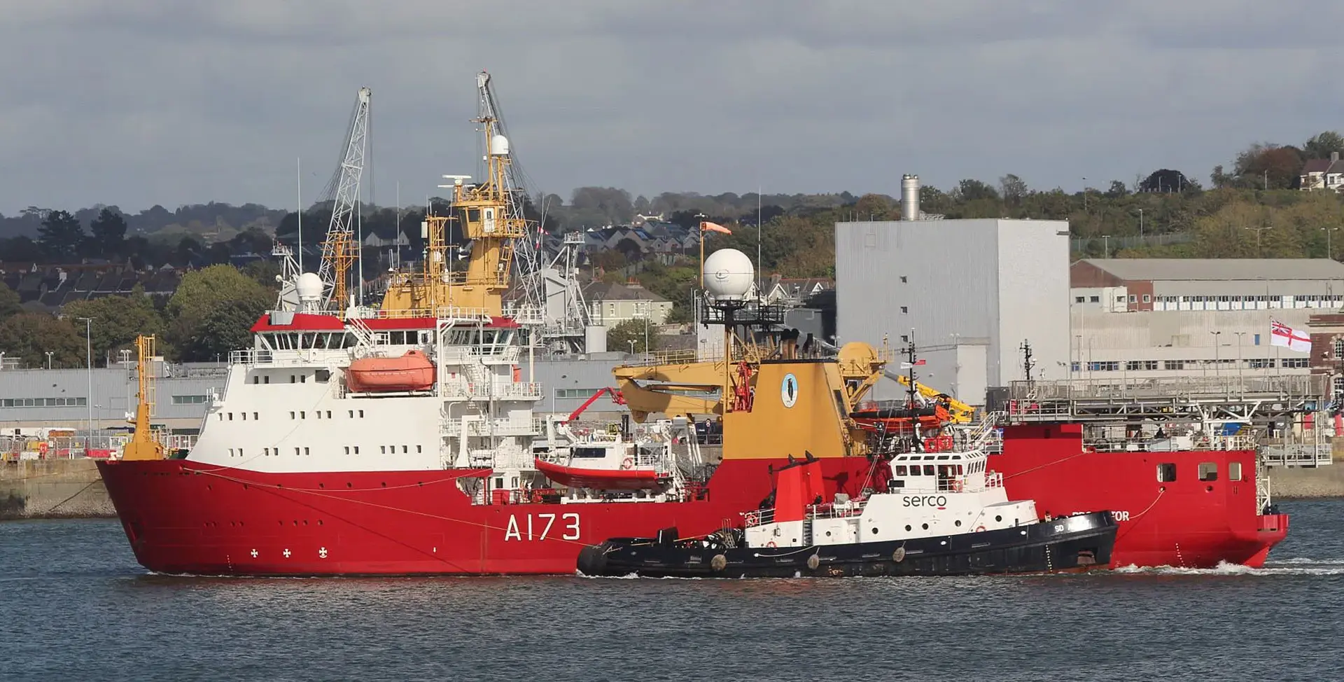 HMS Protector towed into Devonport with her future uncertain