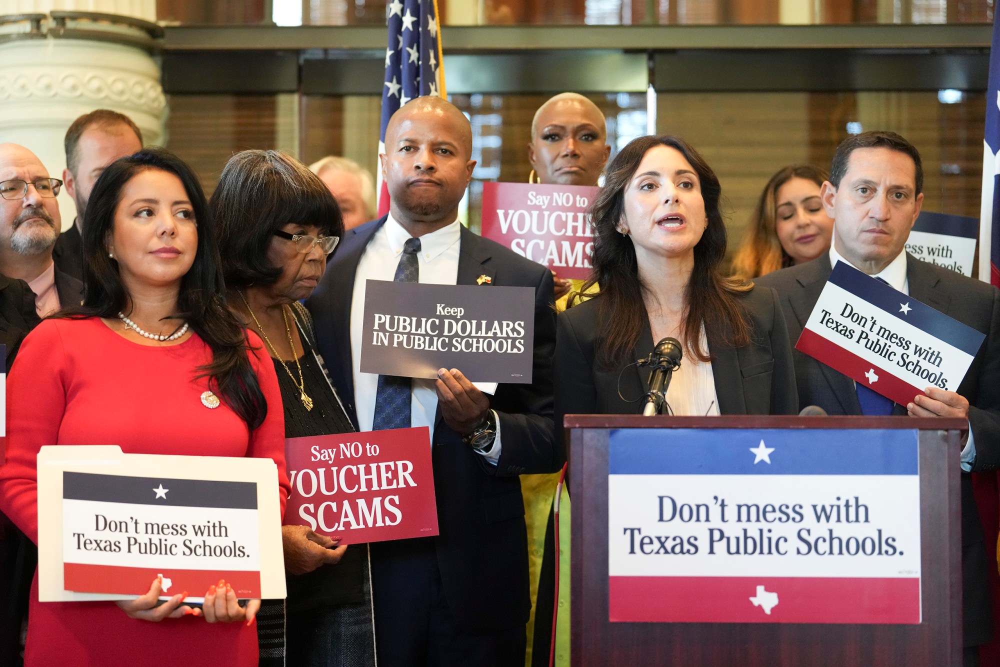 Hinojosa (at the podium) speaks against school vouchers at a press conference prior to the start of the 3rd-called special session of the 88th Legislature on October 2, 2023.