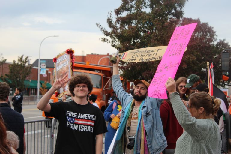 Protesters denounce Trump as a ‘felon’ and ‘pedophile’ at a protest outside his rally in Port Huron, Michigan