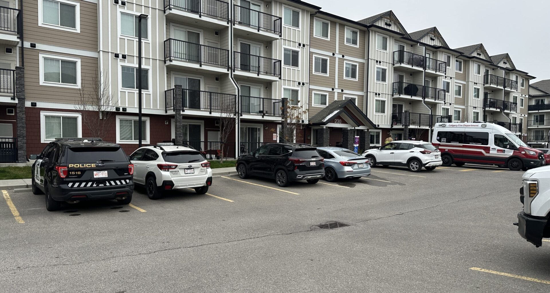 Two people charged after police find body at NE Calgary home