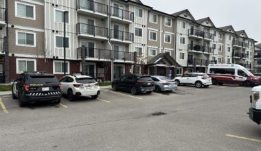 Two people charged after police find body at NE Calgary home