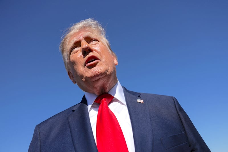 US President Donald Trump speaks to reporters before boarding Air Force One for travel to Michigan from Joint Base Andrews, Maryland, US, October 25, 2026.