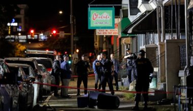 Philadelphia police on the scene at 140 North 52nd St., where two officers were ambushed by a man with a shotgun overnight Saturday.