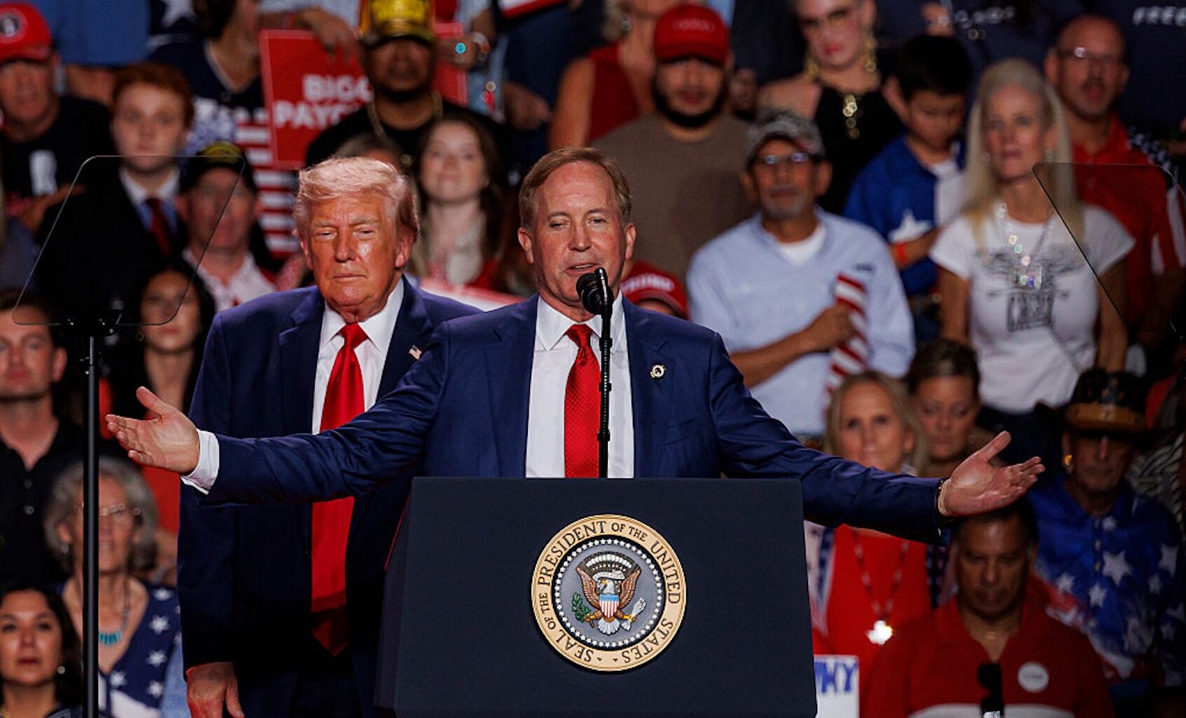 Texas Attorney General Ken Paxton, the Republican candidate for Senate, is flanked by President Donald Trump as he speaks to the crowd during a rally in San Antonio on Oct. 7, 2026. (San Antonio Express-News/Heart Newspapers)