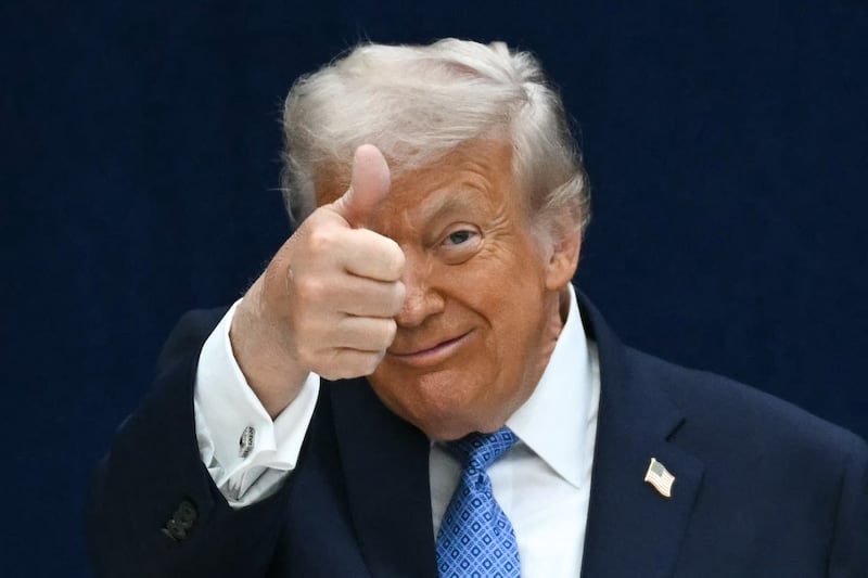 U.S. President Donald Trump gives a thumbs up.